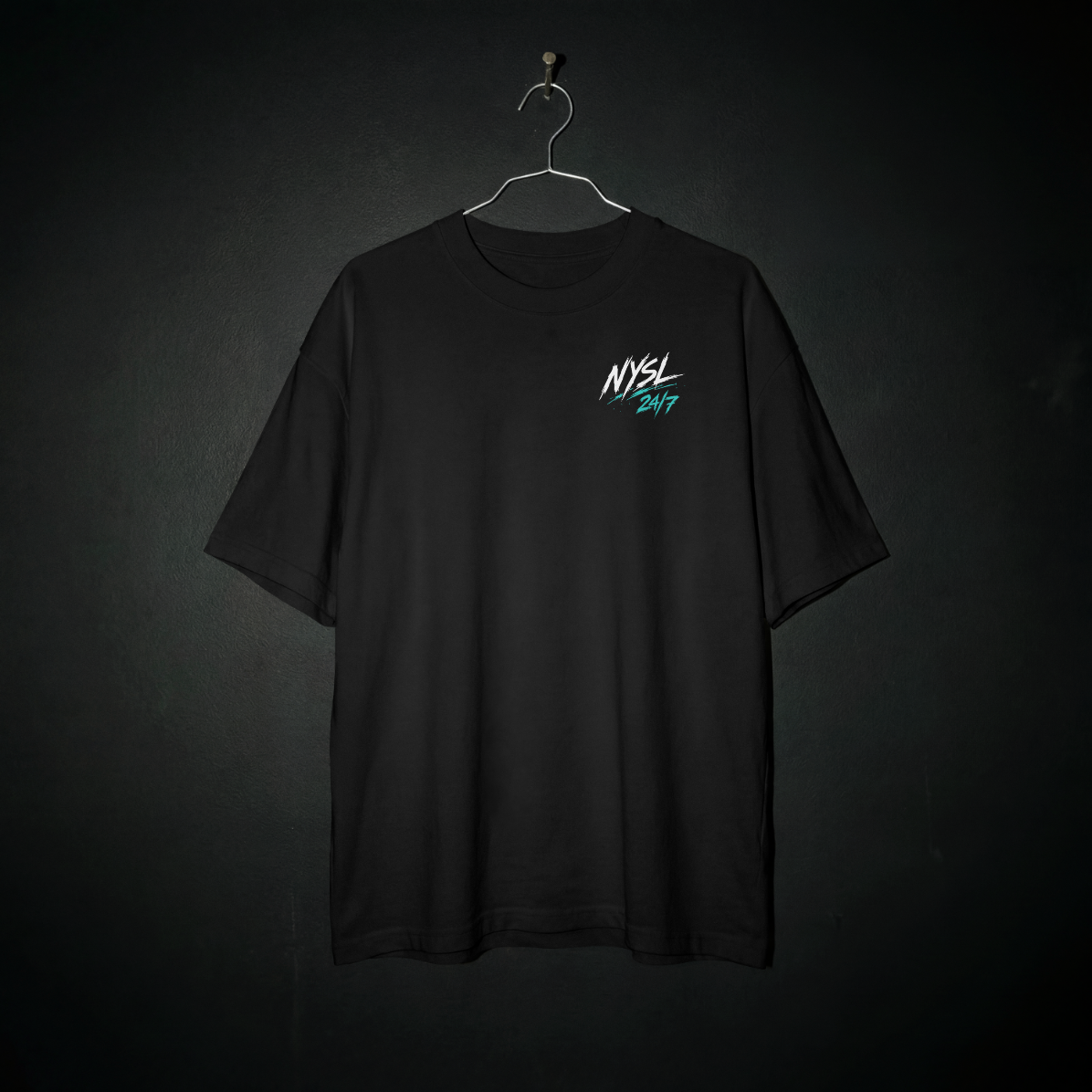 Smiley 1.0 Tee front – white and teal NYSL 24/7 left chest logo on black