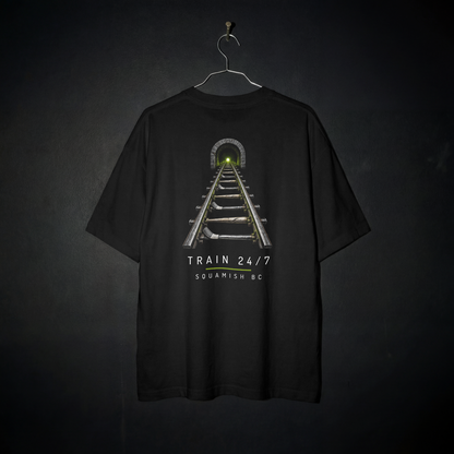 Train Yard Tee back – railway tracks with baseball bat and hockey stick ties leading into a tunnel, with Train 24/7 and Squamish BC lettering